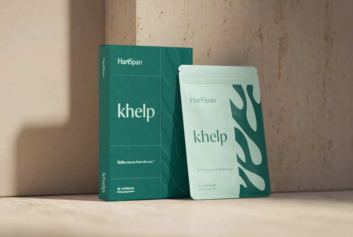 Minimalistic and elegant packaging of HartSpan, by FORNER STUDIO, featuring a soothing color palette with shades of blue and green, representing longevity and natural healing. The design incorporates an organic kelp silhouette, emphasizing the brand's use of natural seaweed ingredients to combat acid reflux, especially during pregnancy.