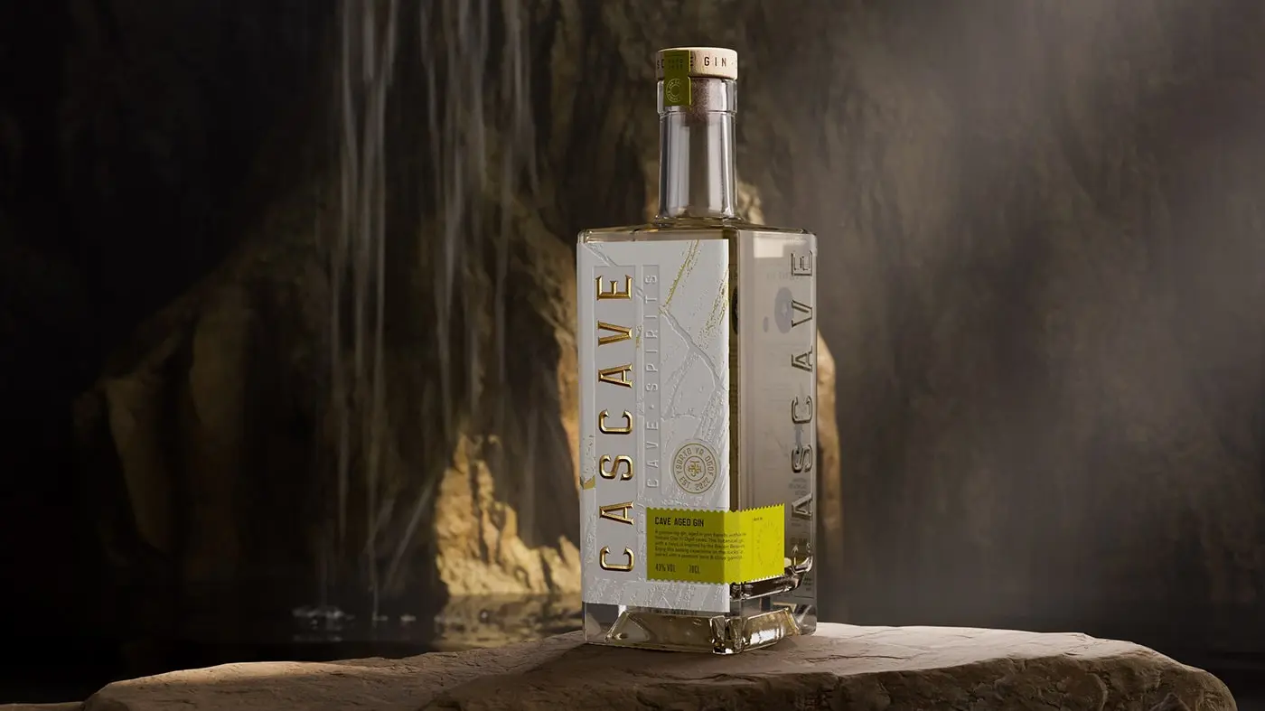 A bottle of Cascave Gin with intricate deboss detailing that resembles the rocky surfaces of Welsh caves, fluted and pressed foils glinting like mineral deposits, set against a palette inspired by the natural colors of the Brecon Beacons.