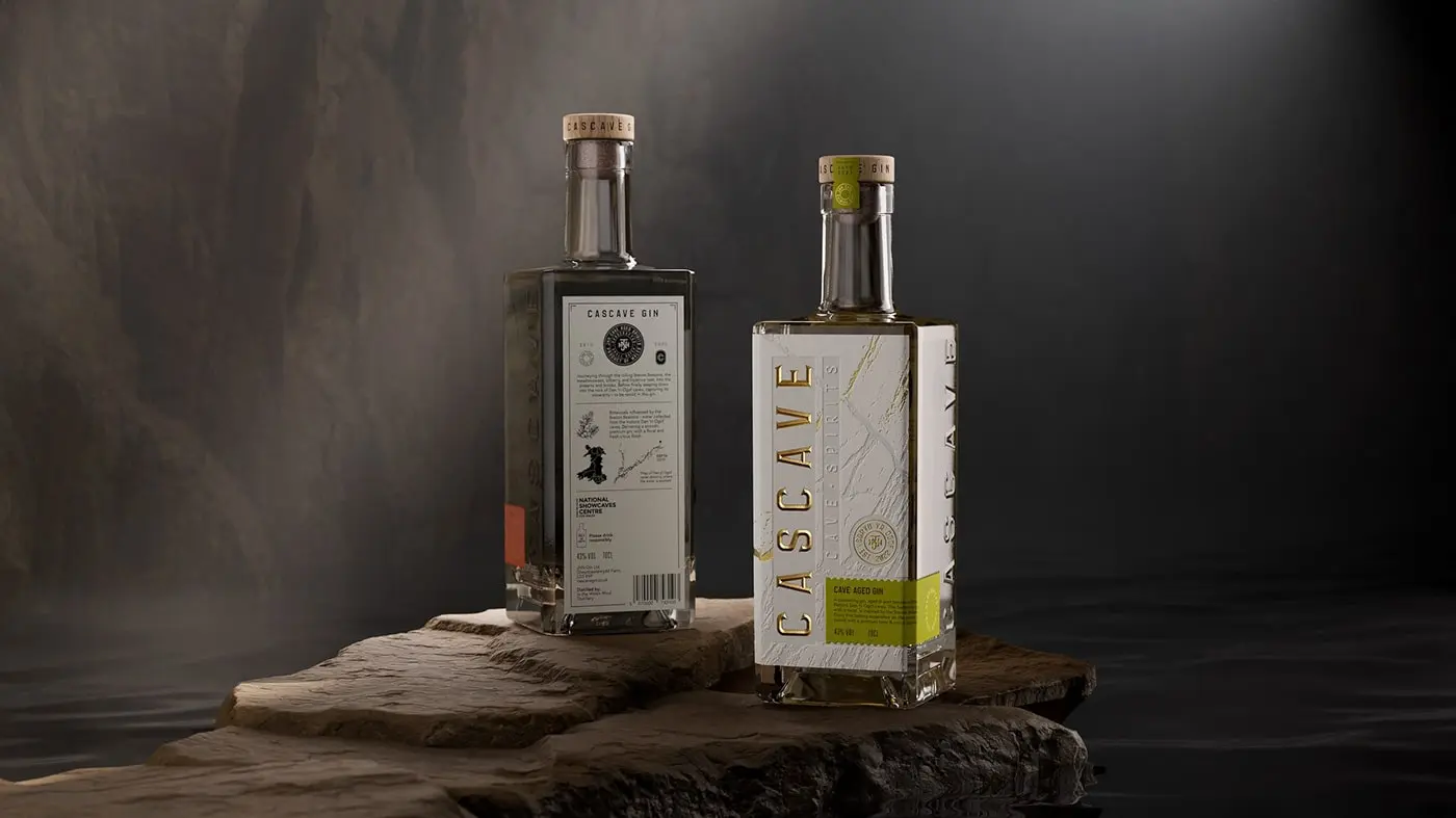 A bottle of Cascave Gin with intricate deboss detailing that resembles the rocky surfaces of Welsh caves, fluted and pressed foils glinting like mineral deposits, set against a palette inspired by the natural colors of the Brecon Beacons.